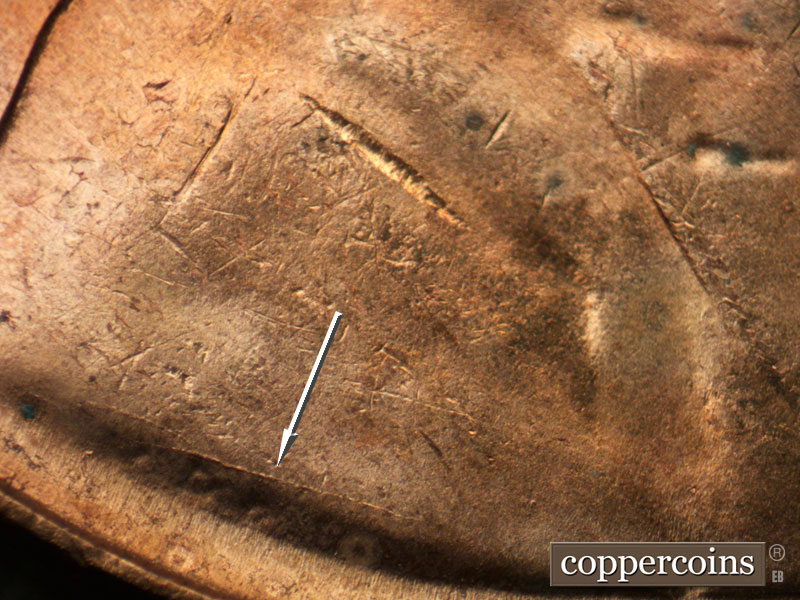 Die-stage B marker on 1955D•1DO•012 (1955 Doubled Die Obverse).