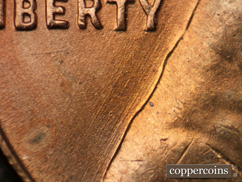 Die-stage B marker on 1955D•1DO•012 (1955 Doubled Die Obverse).