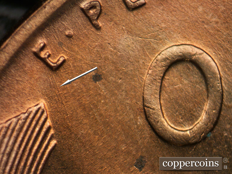 Die-stage B marker on 1955D•1DO•012 (1955 Doubled Die Obverse).