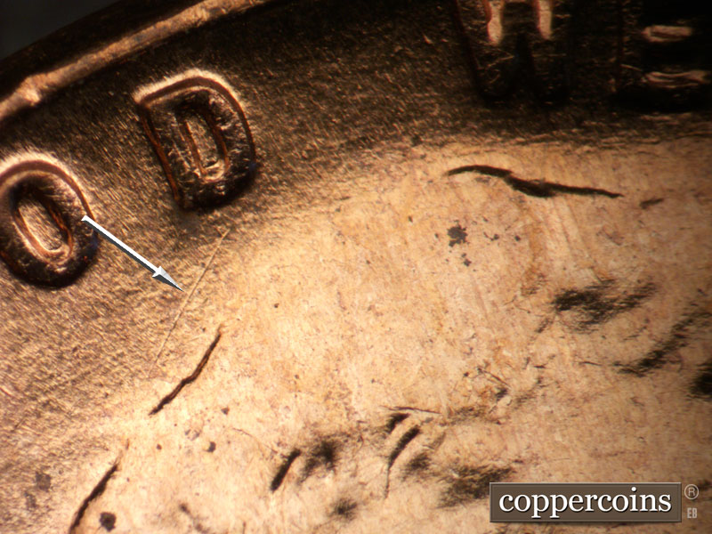 Die-stage B marker on 1955D•1DO•014 (1955 Doubled Die Obverse).