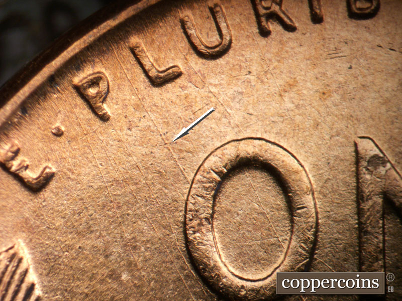 Die-stage B marker on 1955D•1DO•014 (1955 Doubled Die Obverse).