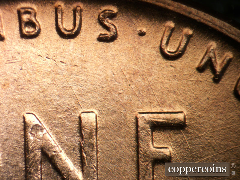 Die-stage B marker on 1955D•1DO•014 (1955 Doubled Die Obverse).