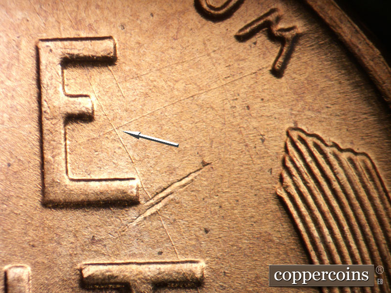 Die-stage B marker on 1955D•1DO•014 (1955 Doubled Die Obverse).