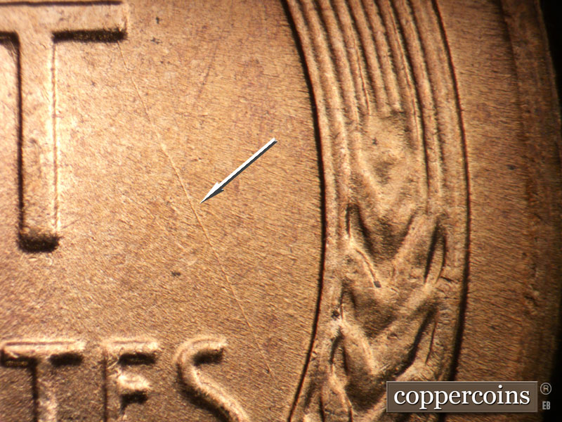 Die-stage B marker on 1955D•1DO•014 (1955 Doubled Die Obverse).