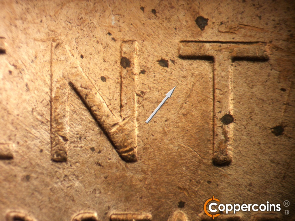 Die-stage C marker on 1955D•1DO•015 showing SE die scratch connects NT in CENT.
