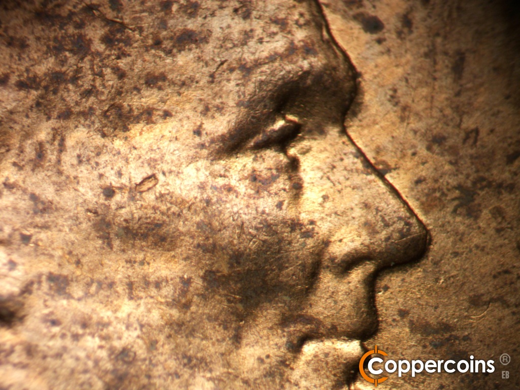 Die-stage B marker on 1955D•1DO•016 showing Closeup of dopubled eyelid.