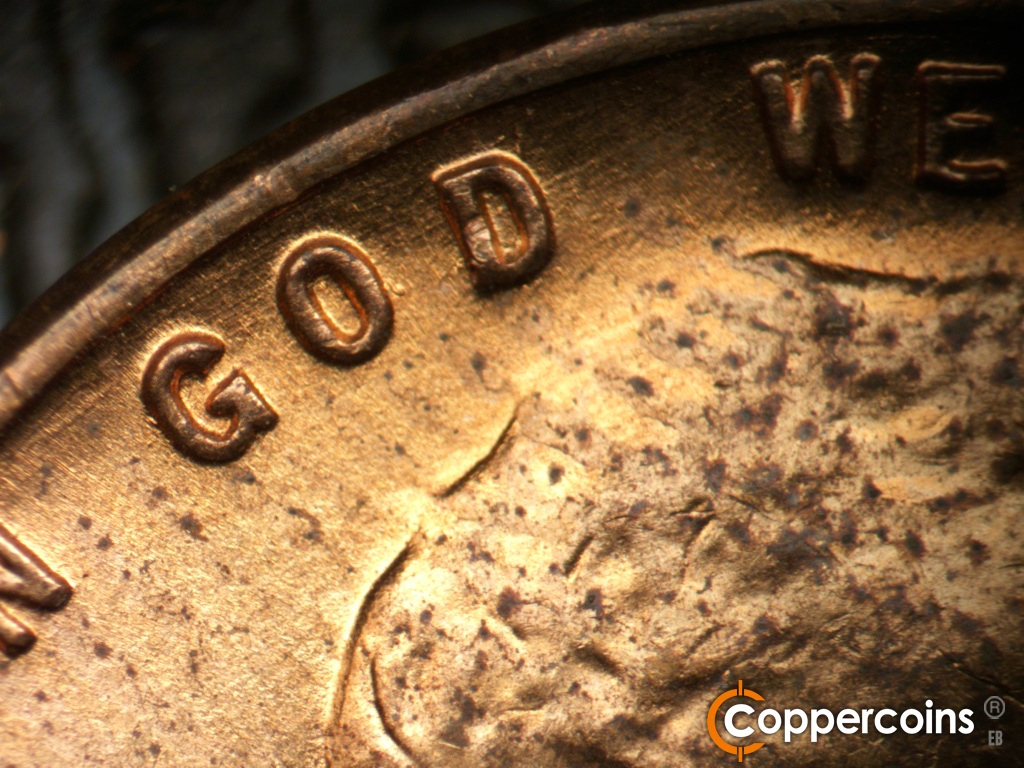 Die-stage B marker on 1955D•1DO•016 showing Die gouge near O in GOD. Light NE die scratches through GOD.