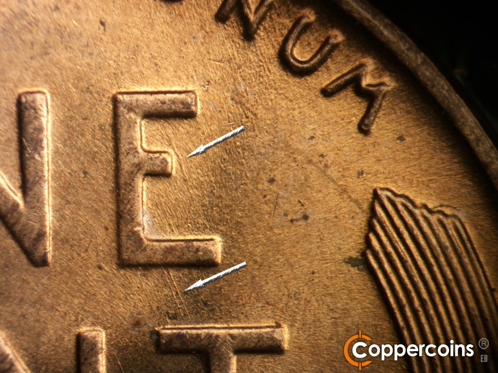 Die-stage B marker on 1955D•1DO•016 showing SE die scratch in E of ONE. SE die scratches connect E in ONE to T in CENT.