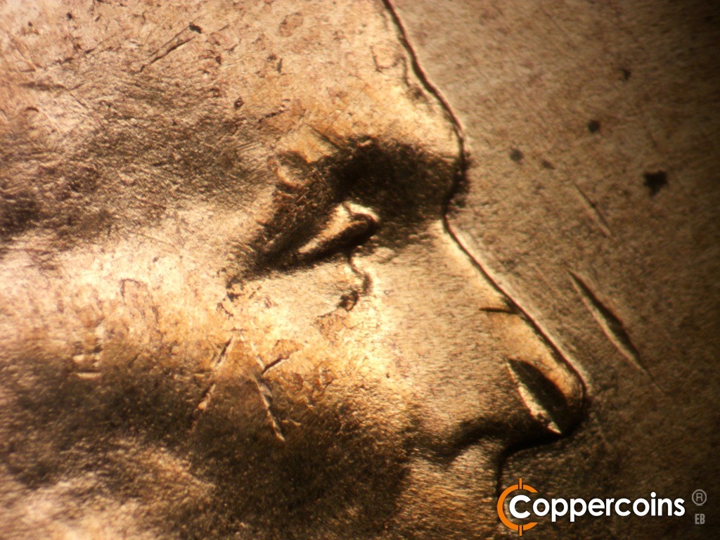 Die-stage B marker on 1955D•1DO•017 showing Extra upper EYElid south of primary.
