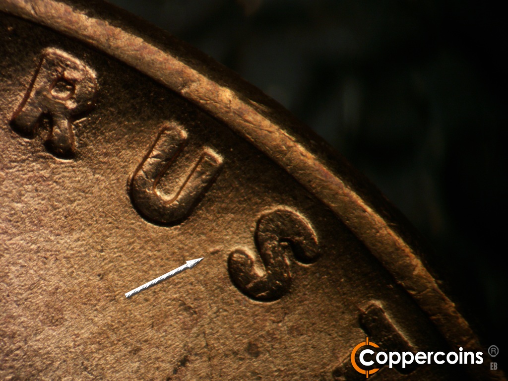 Die-stage B marker on 1955D•1DO•017 showing Doubling seen on bottom of U in TRUST. Die gouge near S in TRUST.