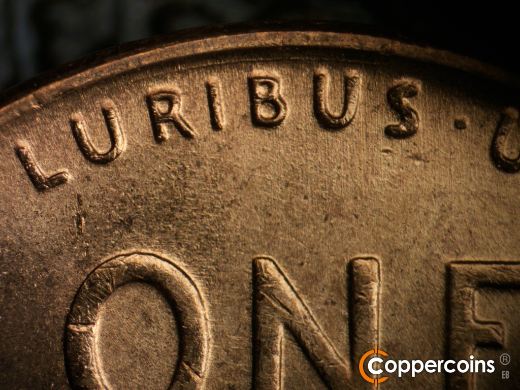 Die-stage B marker on 1955D•1DO•017 showing Concentric die scratch between rim and PLURIBUS>.