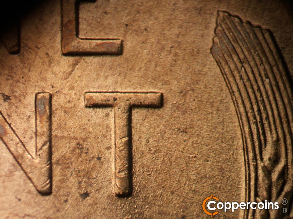 Die-stage B marker on 1955D•1DO•017 showing Concentric die scratches near of T in CENT.