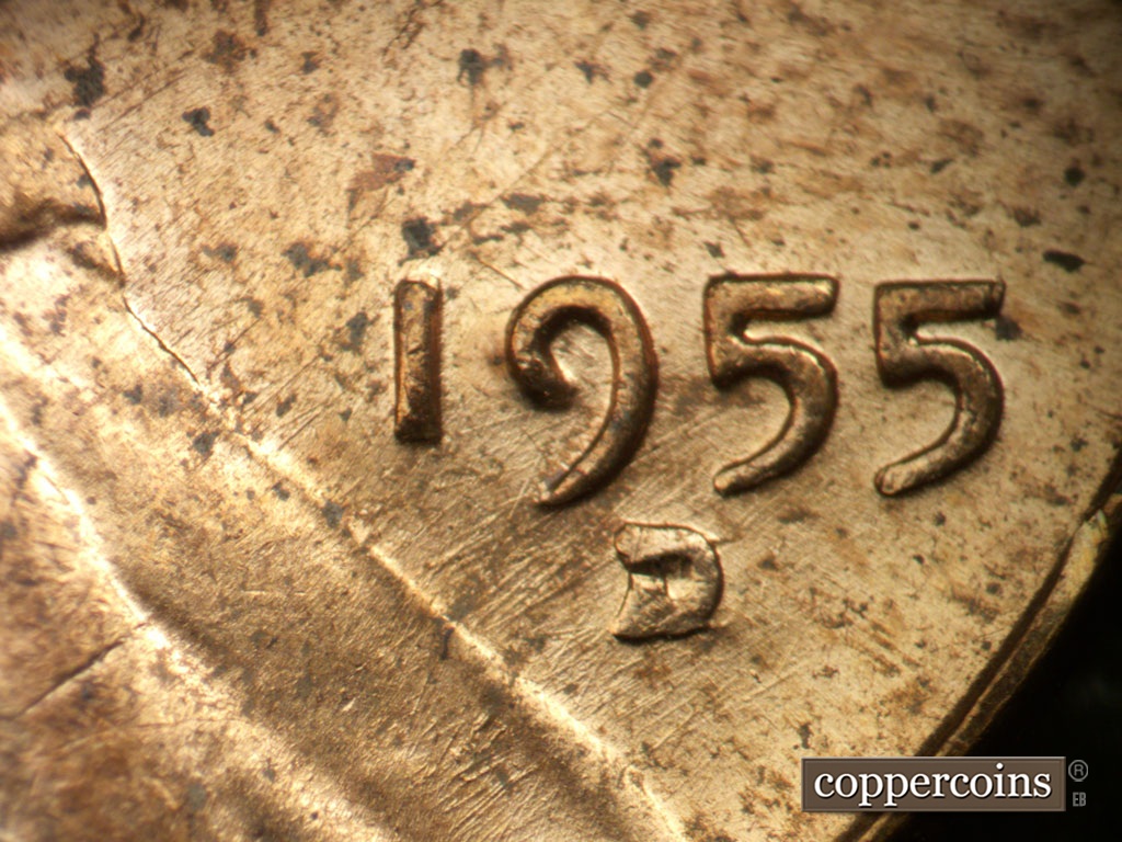 Die-stage B marker on 1955D•1MM•003 showing NE die scratches throughout date area.
