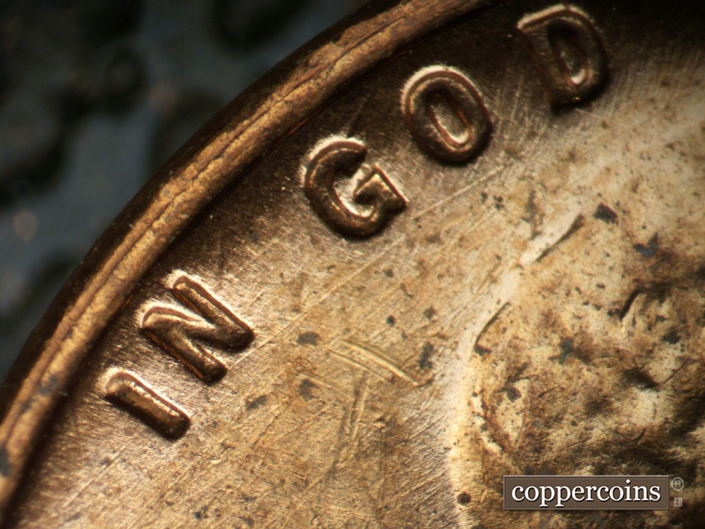 Die-stage B marker on 1955D•1MM•003 showing Die scratches throughout area around IN GOD.