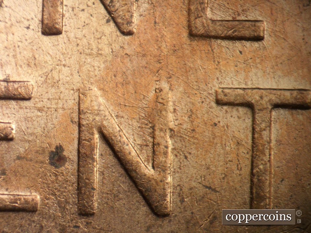 Die-stage B marker on 1955D•1MM•003 showing Die scratches through N in CENT. Die clash visible on top of N in CENT.