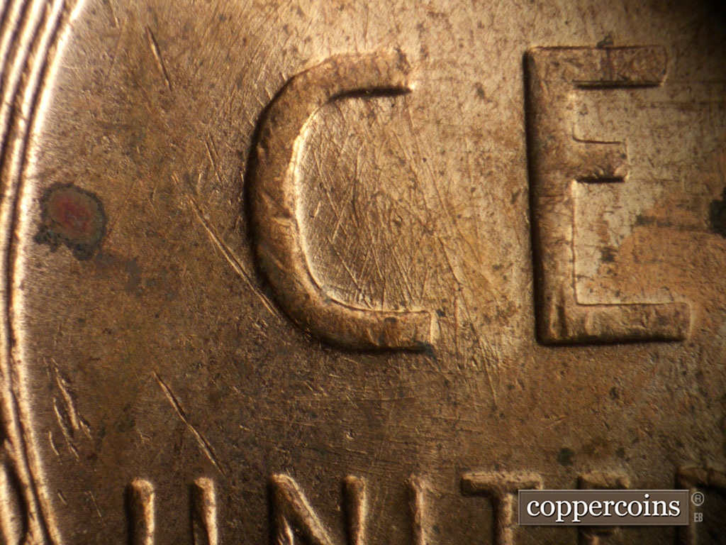 Die-stage B marker on 1955D•1MM•003 showing Die scratches inside C of CENT.