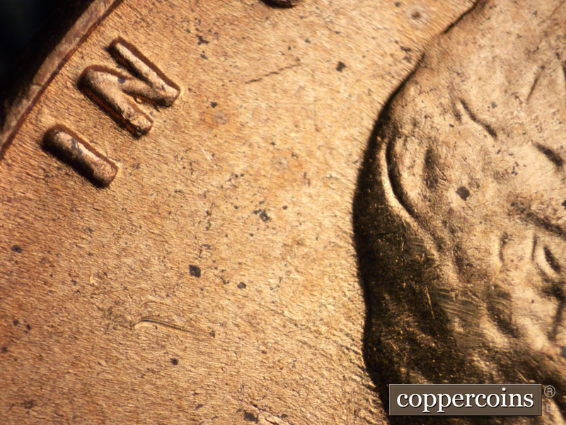 Die-stage B marker on 1955D•1MM•049 (1955 Repunched Mint Mark).