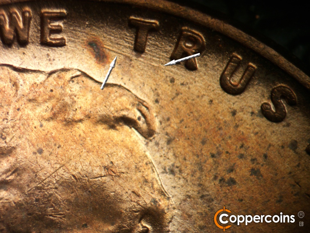 Die-stage B marker on 1955D•1MM•072 showing N/S die scratch from between TR in TRUST toward forehead. ESE die scratches from E in WE running under TR in TRUST.