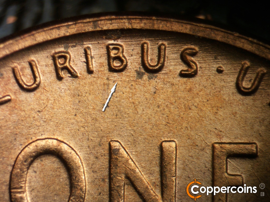 Die-stage B marker on 1955D•1MM•072 showing Unique die scratch from bottom of I in PLURIBUS. Generall E/W die scratches through PLURIBUS.