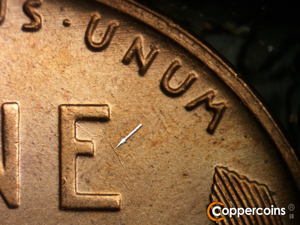 Die-stage B marker on 1955D•1MM•072 showing Unique die scratch in E of ONE. E/W die scratches thhrough UNUM.