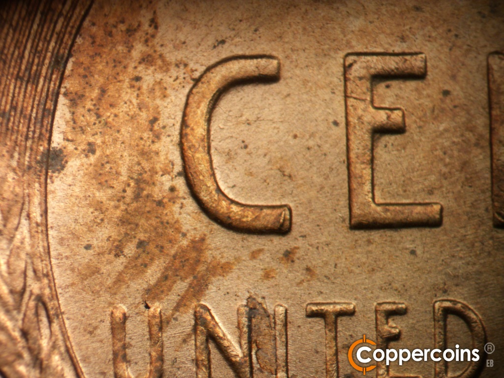 Die-stage B marker on 1955D•1MM•072 showing Die wear on C in CENT. Die gouge on lower C in CENT.