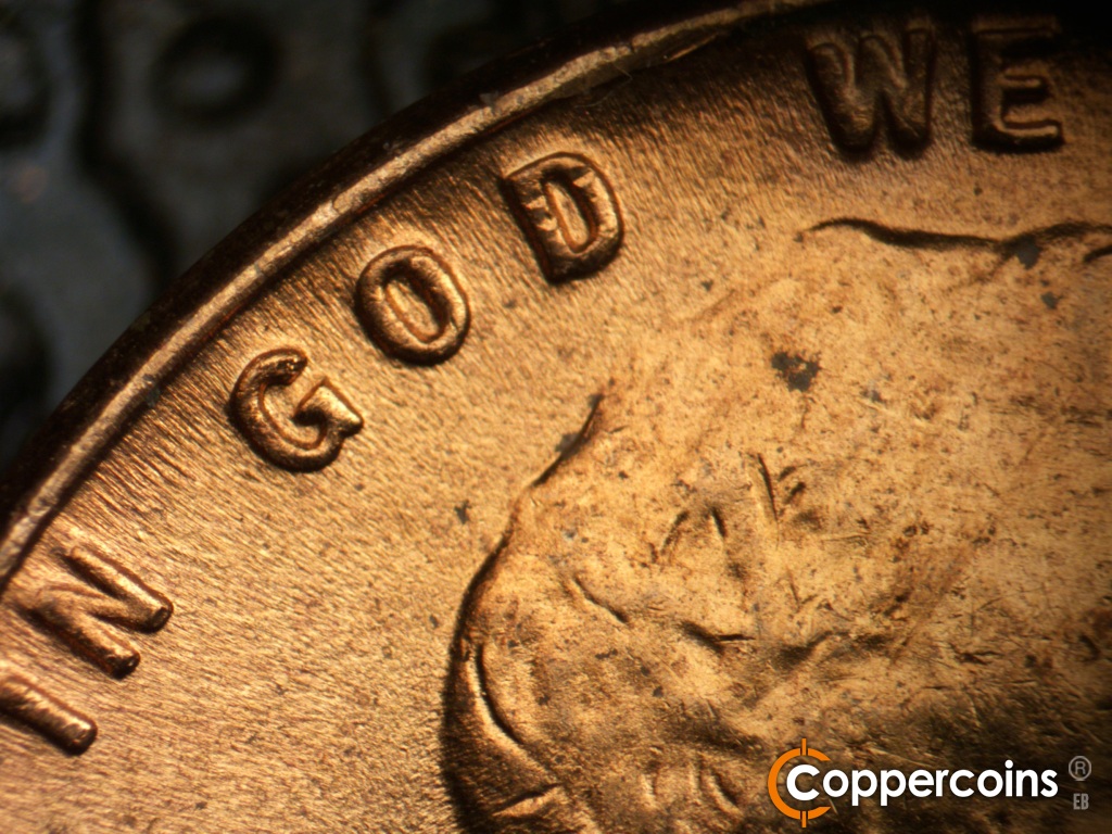 Die-stage C marker on 1955D•1MM•072 showing Die scratch from D in GOD worn away.