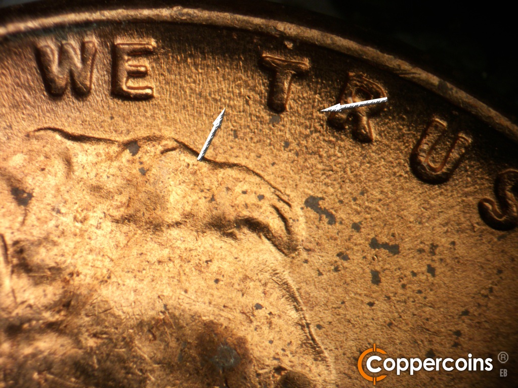 Die-stage C marker on 1955D•1MM•072 showing N/S die scratch from between TR in TRUST still visible. E/W die scratches from E in WE still visible.