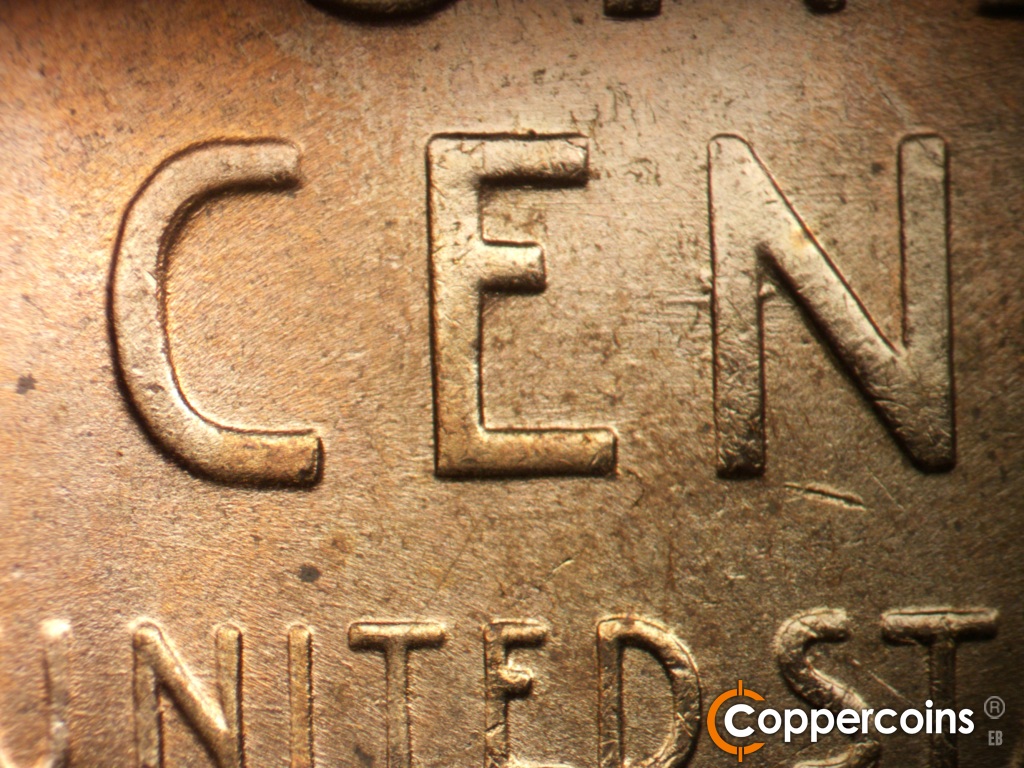 Die-stage C marker on 1955D•1MM•072 showing Die wear on C in CENT. Die gouge on lower C in CENT. Strong die gouges from top left of N in CENT.