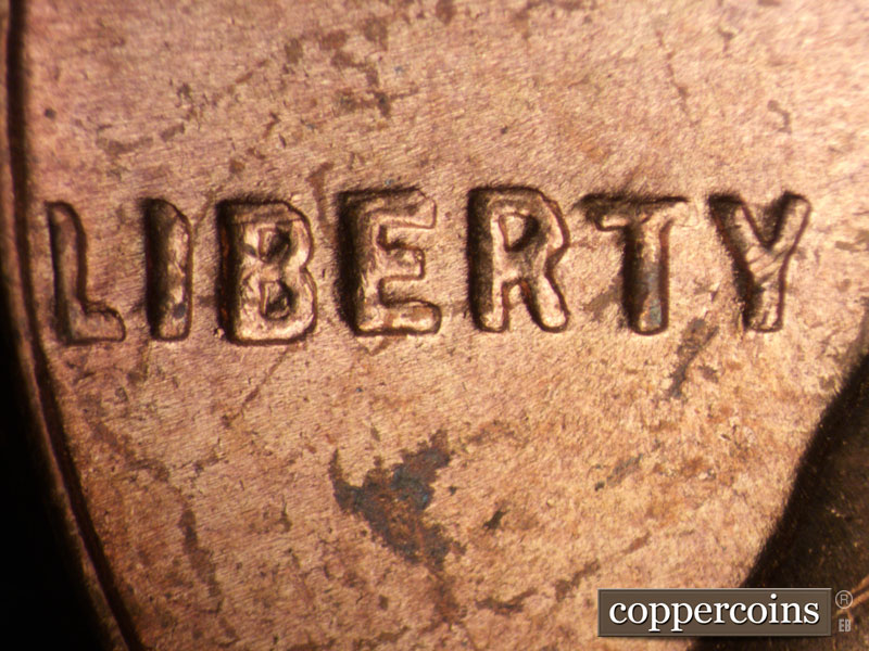 Die-stage B marker on 1955P•1DO•002 (1955 Doubled Die Obverse).