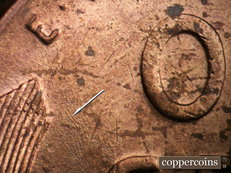 Die-stage B marker on 1955P•1DO•002 (1955 Doubled Die Obverse).