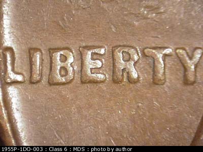 Die-stage B marker on 1955P•1DO•003 (1955 Doubled Die Obverse).