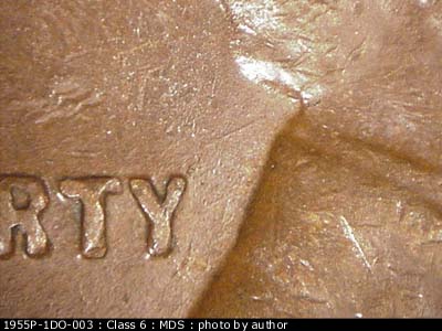 Die-stage B marker on 1955P•1DO•003 (1955 Doubled Die Obverse).
