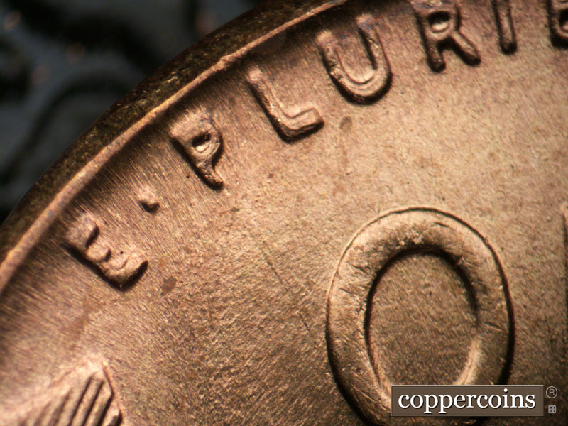 Die-stage B marker on 1955P•1DO•004 (1955 Doubled Die Obverse).