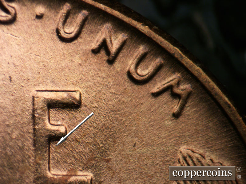 Die-stage B marker on 1955P•1DO•004 (1955 Doubled Die Obverse).