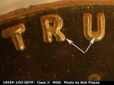 Die-stage B marker on 1955P•1DO•007P showing Arrows point to the separation in the word trust.