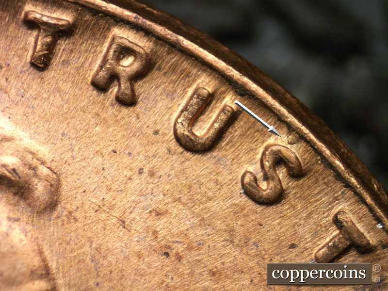 Die-stage B marker on 1955P•1DO•011 (1955 Doubled Die Obverse).