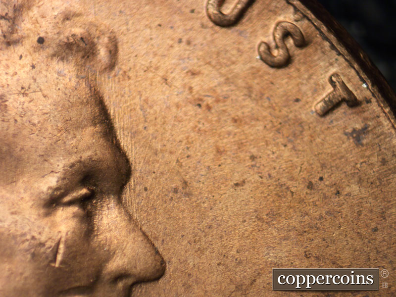 Die-stage B marker on 1955P•1DO•011 (1955 Doubled Die Obverse).