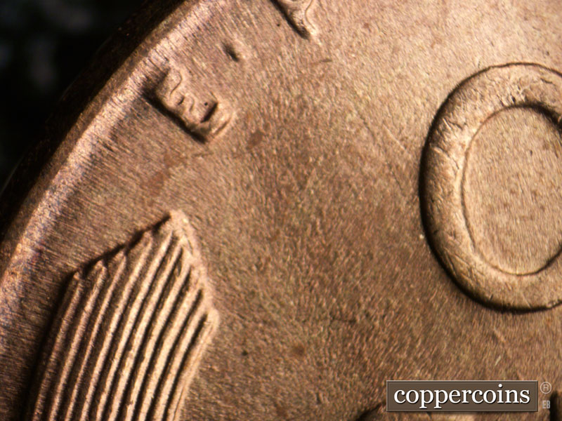 Die-stage B marker on 1955P•1DR•001 (1955 Doubled Die Reverse).