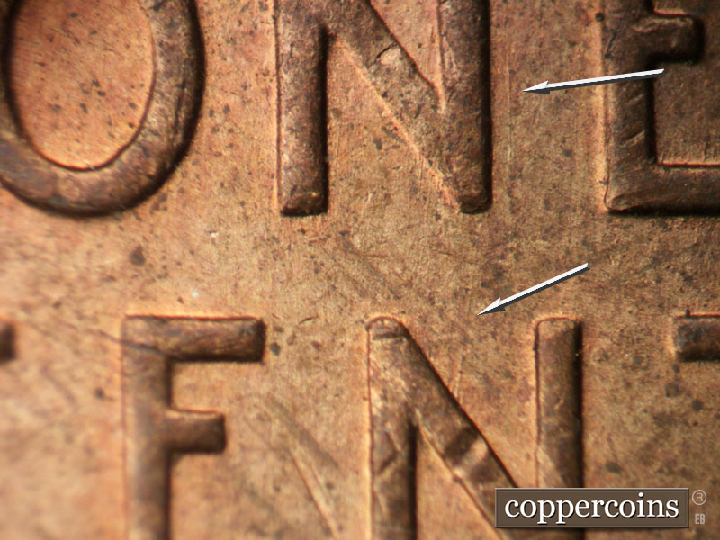 Die-stage B marker on 1955P•1DR•005 (1955 Doubled Die Reverse).