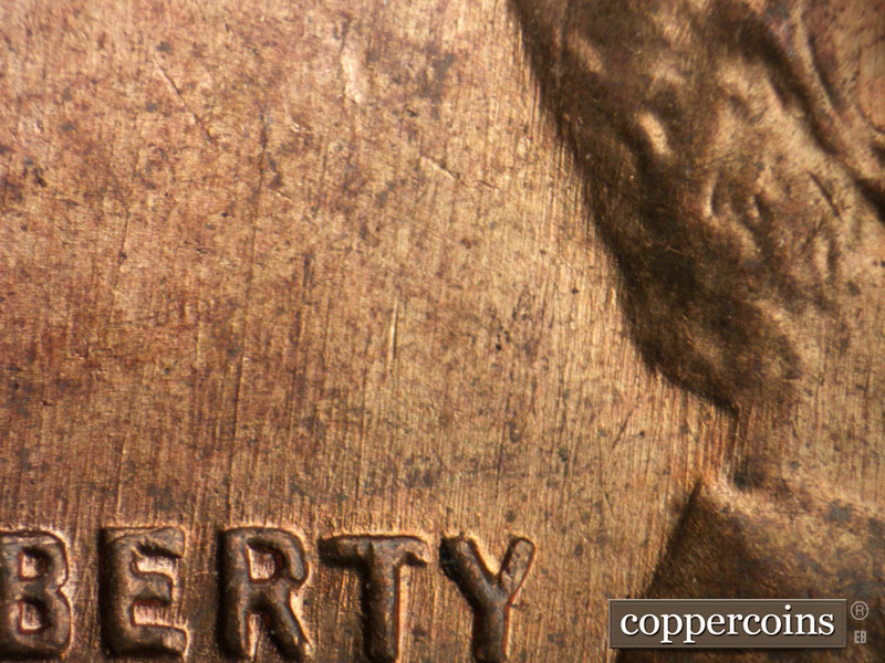 Die-stage B marker on 1955P•1DR•005 (1955 Doubled Die Reverse).