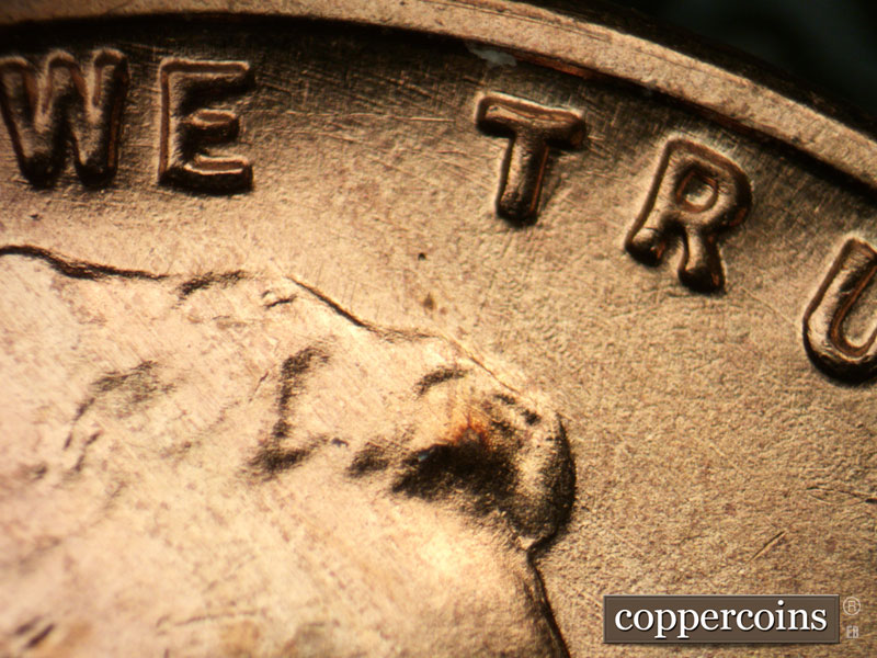 Die-stage B marker on 1955S•1DO•002 (1955 Doubled Die Obverse).
