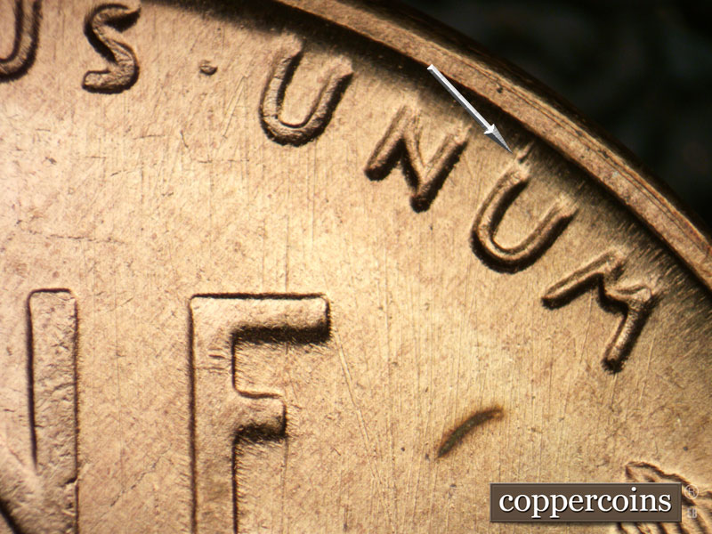 Die-stage B marker on 1955S•1DO•002 (1955 Doubled Die Obverse).