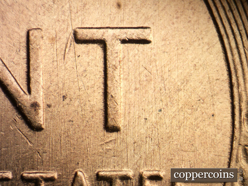 Die-stage B marker on 1955S•1DO•002 (1955 Doubled Die Obverse).
