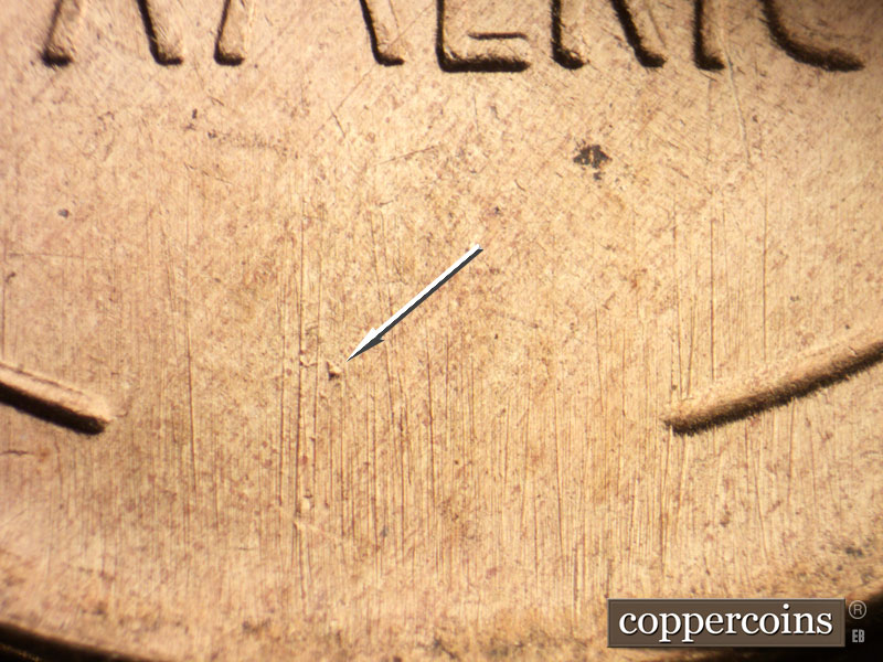 Die-stage B marker on 1955S•1DO•002 (1955 Doubled Die Obverse).