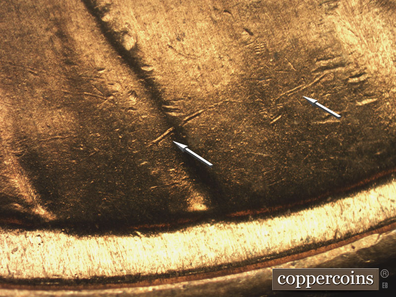 Die-stage B marker on 1955S•1MM•002 showing Die crack starting to form across lapel and jacket.