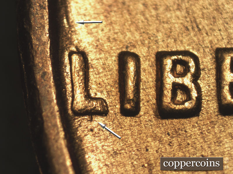 Die-stage B marker on 1955S•1MM•002 showing Die gouge above and below L in LIBERTY.