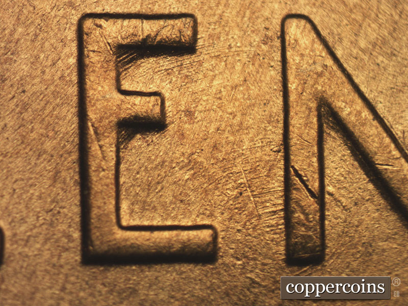 Die-stage B marker on 1955S•1MM•002 showing Concentric die scratches though EN in CENT.