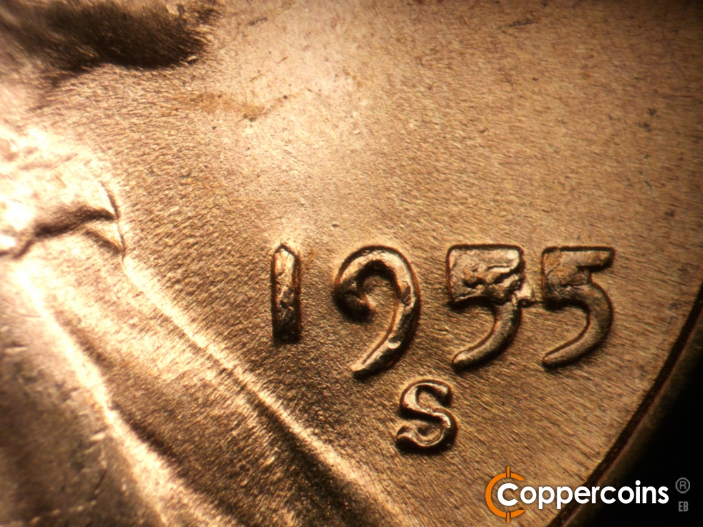 Die-stage D marker on 1955S•1MM•002 showing Die chip on the upper first 5 in thte date. Die chip on second 5 in date has progressed.