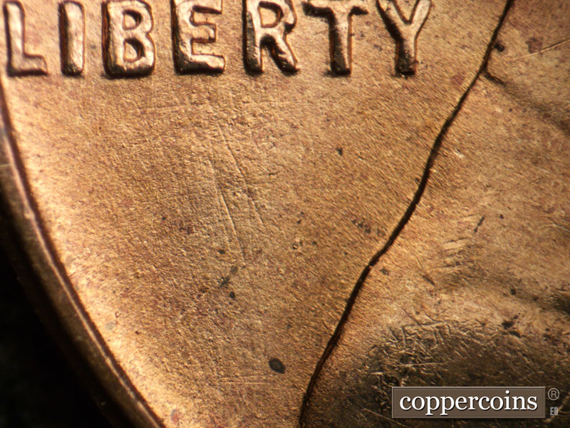 Die-stage B marker on 1955S•1MM•007 (1955 Repunched Mint Mark).