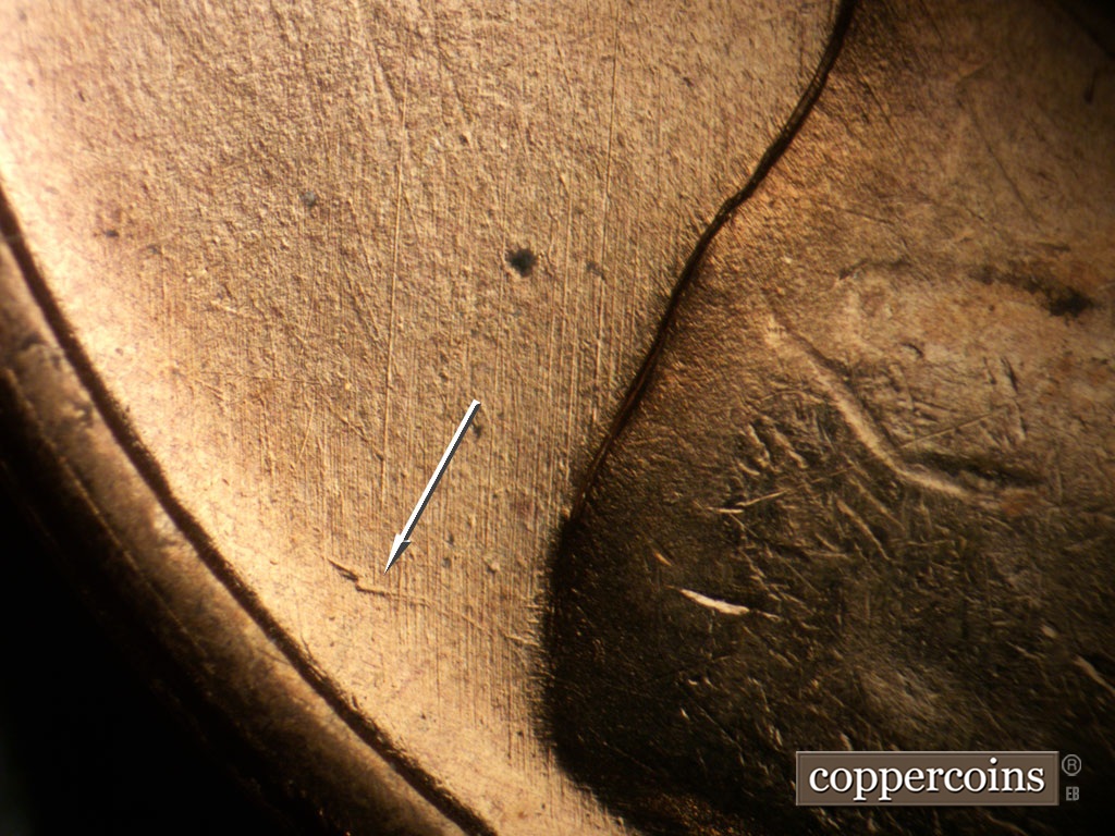 Die-stage A marker on 1955S•1MM•019 showing Unique die scratch from back of shoulder.
